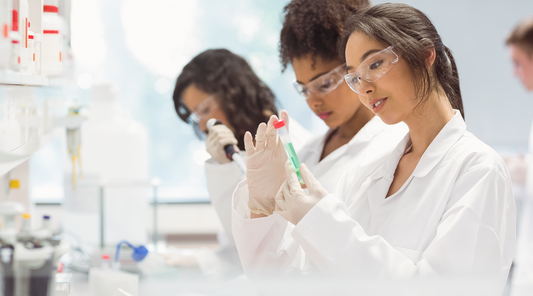 woman inspecting test tube in labratory