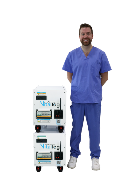 a doctor standing next to two of the 7kwh battery backups stacked on top of each other